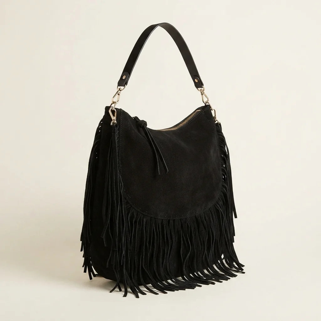 Black bohemian fringe bag, three-quarter angle showing side depth