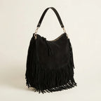 Black bohemian fringe bag, three-quarter angle showing side depth