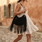 Woman wearing Black bohemian fringe bag with swaying fringe