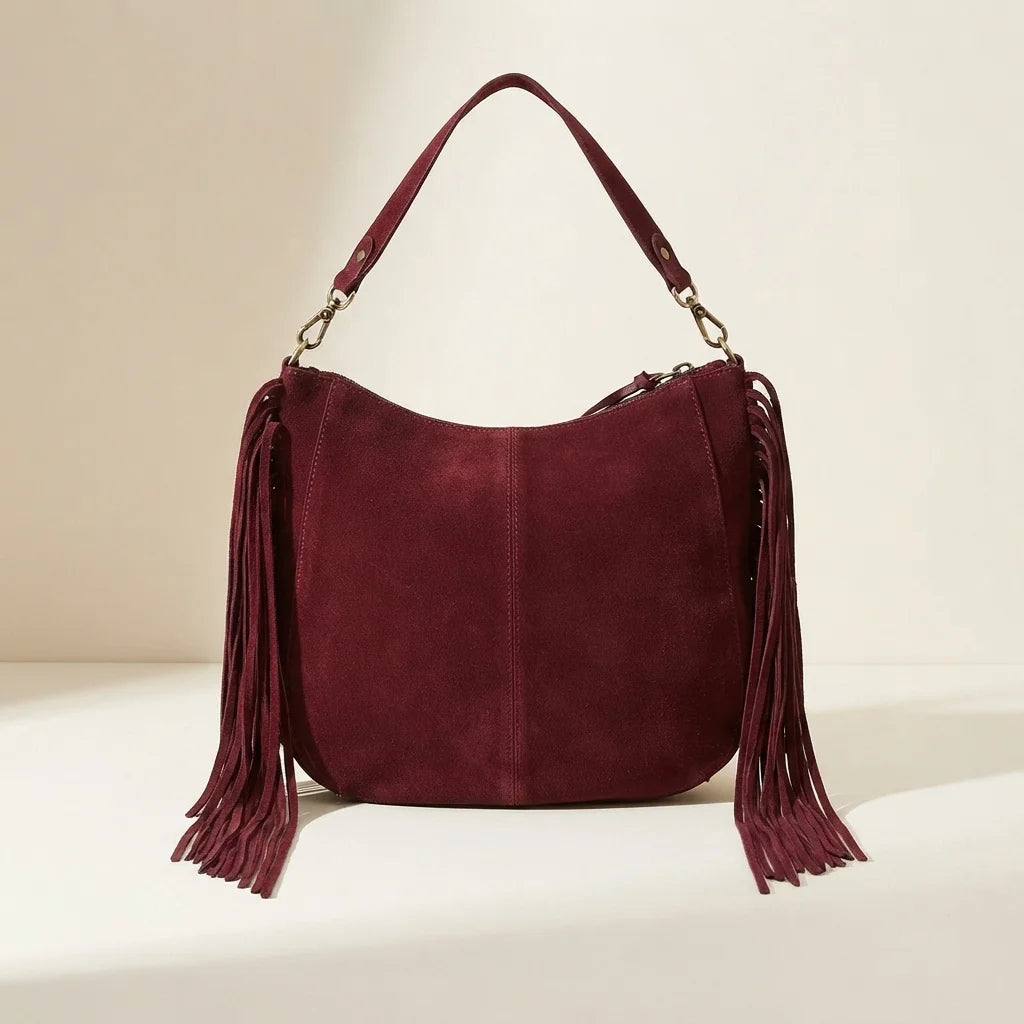 Back panel of Burgundy bohemian fringe bag with strap attachments