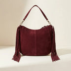 Back panel of Burgundy bohemian fringe bag with strap attachments
