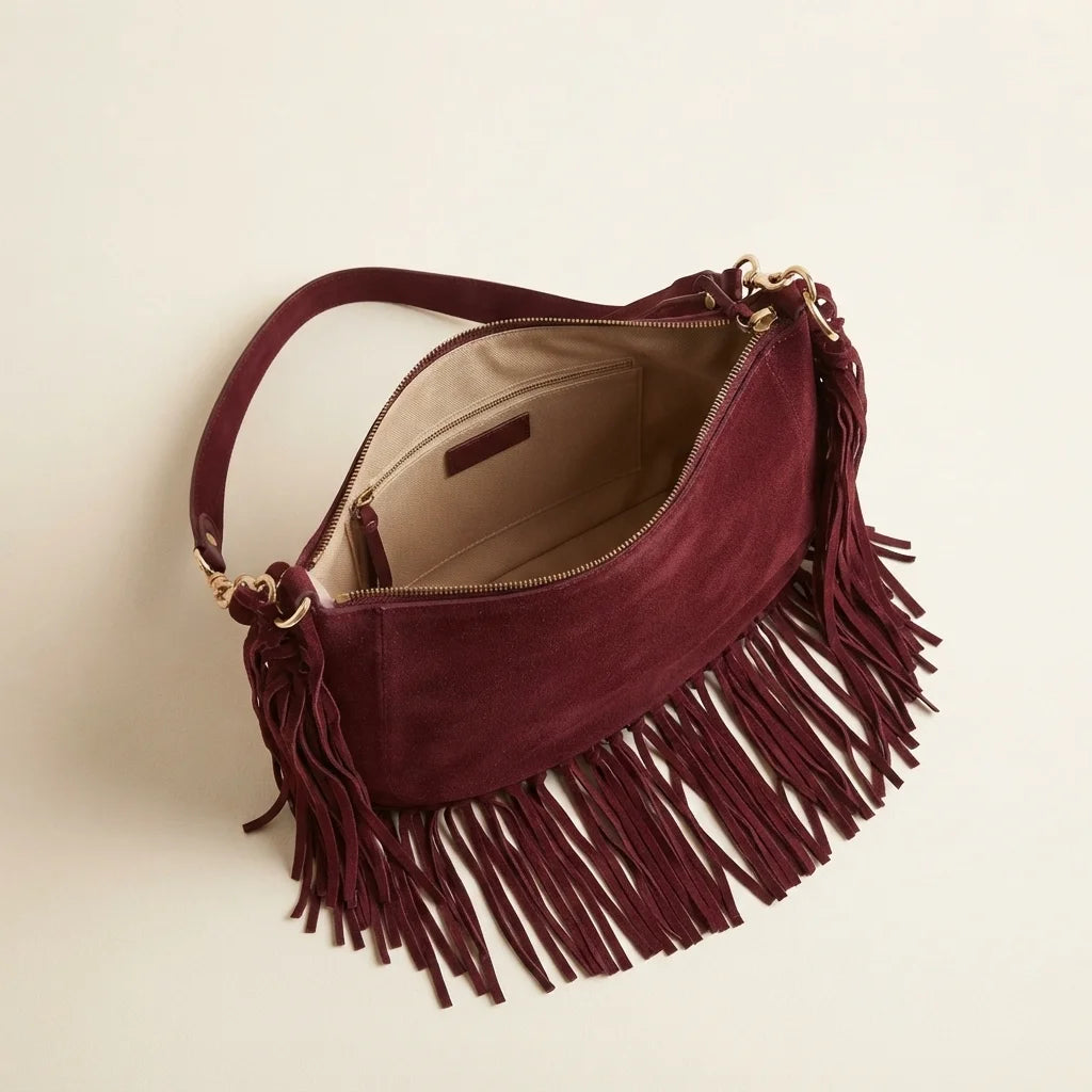 Interior lining and pockets of Burgundy bohemian fringe bag