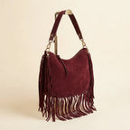 Burgundy bohemian fringe bag, three-quarter angle showing side depth