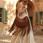 Woman wearing Coffee bohemian fringe bag with swaying fringe
