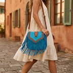 Woman wearing Blue bohemian fringe crossbody bag with swaying fringe
