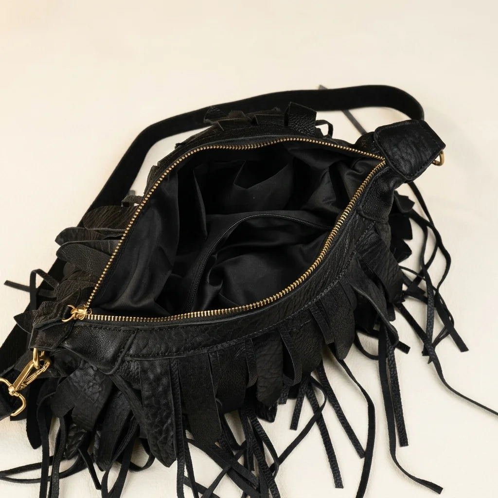 Interior lining and pockets of Black bohemian tassel fringe bag