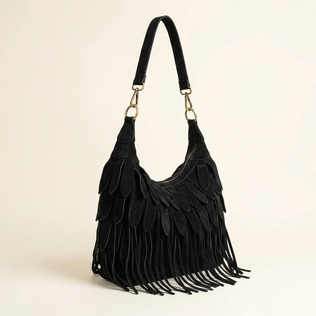 Black bohemian tassel fringe bag, three-quarter angle showing side depth