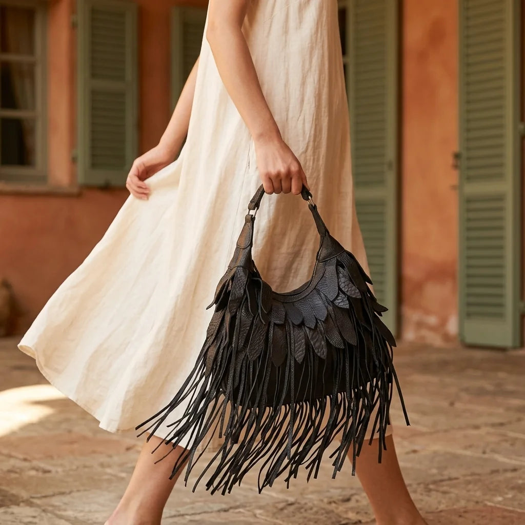 Woman wearing Black bohemian tassel fringe bag with swaying fringe