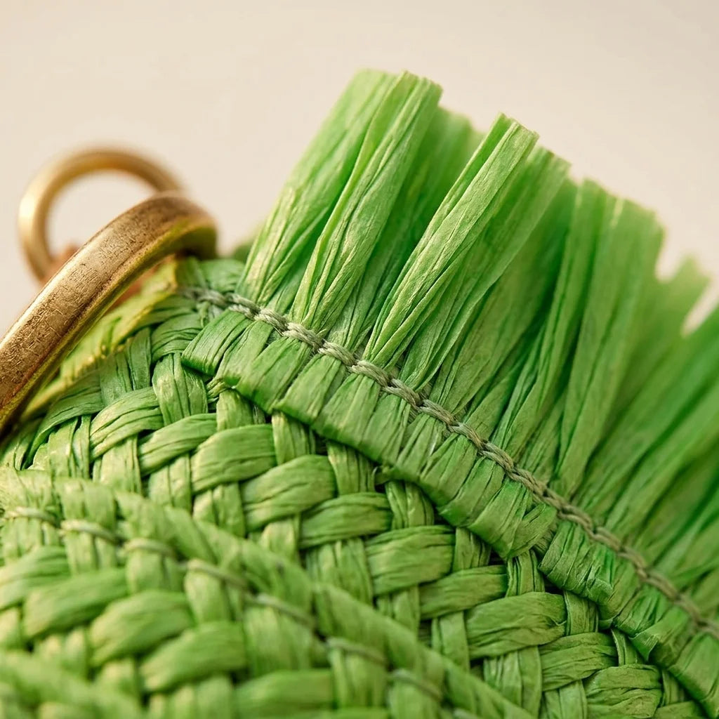 Close-up of fringe stitching and texture on Green boho fringe bag clutch