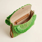 Interior lining and pockets of Green boho fringe bag clutch