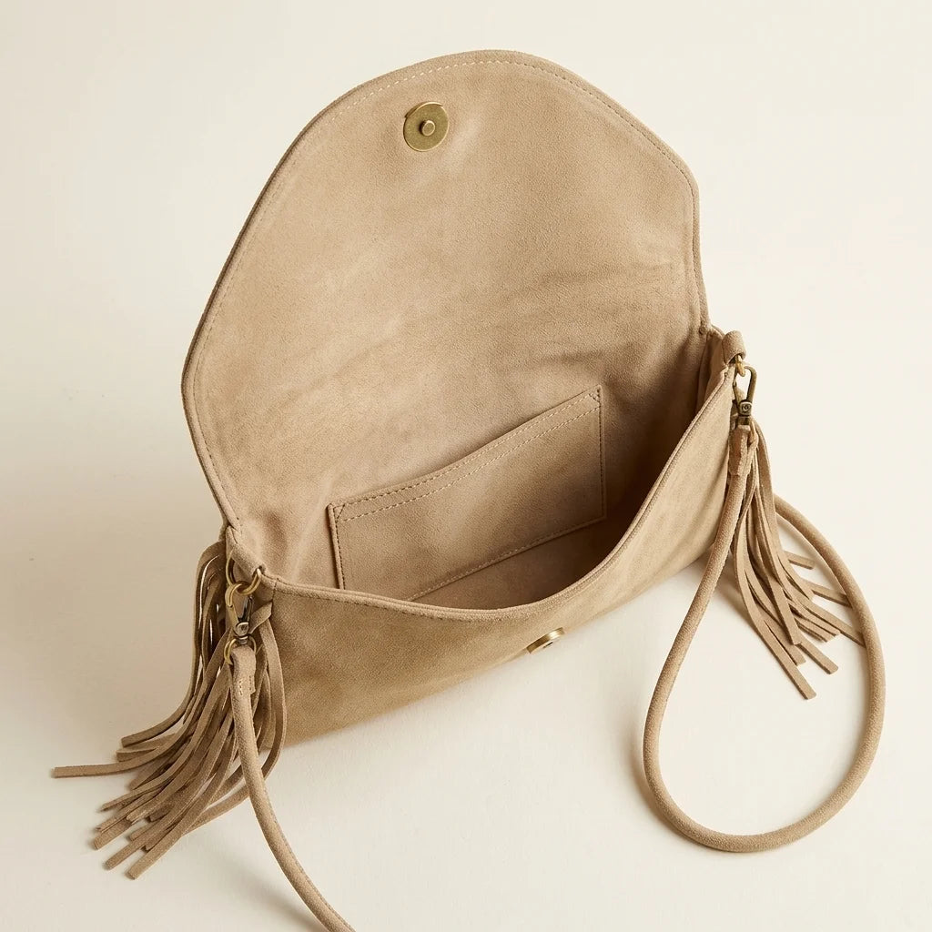 Interior lining and pockets of Khaki boho fringe bag clutch