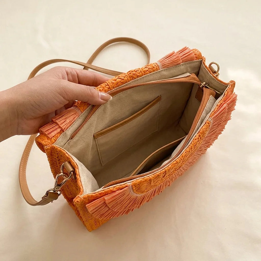 Interior lining and pockets of Orange boho fringe bag clutch