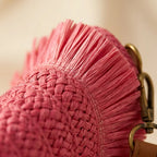 Close-up of fringe stitching and texture on Pink boho fringe bag clutch