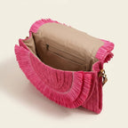 Interior lining and pockets of Pink boho fringe bag clutch