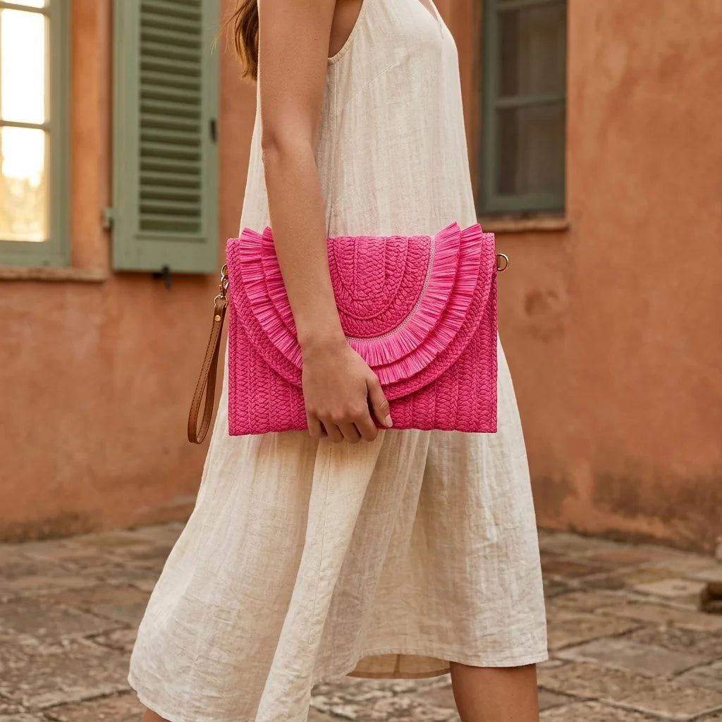 Woman wearing Pink boho fringe bag clutch with swaying fringe