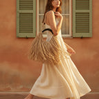 Woman wearing Tan boho fringe hobo bag with swaying fringe