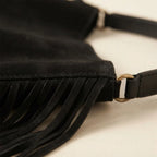 Close-up of fringe stitching and texture on Black boho leather fringe bag