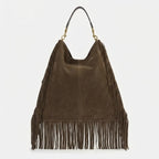 Back panel of Brown boho leather fringe bag with strap attachments