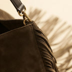 Close-up of fringe stitching and texture on Brown boho leather fringe bag