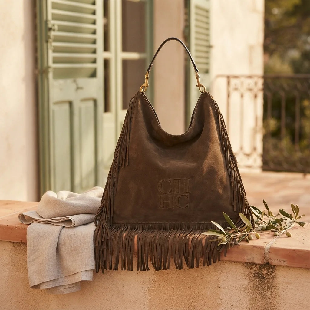 Coffee boho leather fringe bag styled in a warm Mediterranean setting