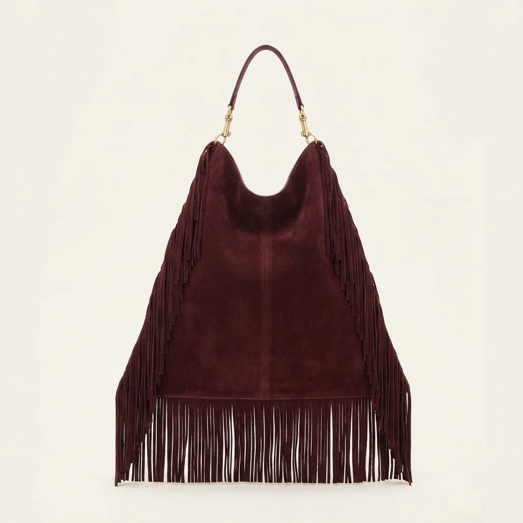 Back panel of Maroon boho leather fringe bag with strap attachments