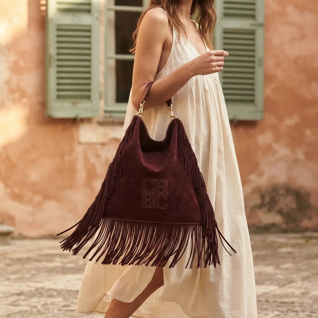 Woman wearing Maroon boho leather fringe bag with swaying fringe