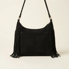 Back panel of Black boho style fringe bag with strap attachments
