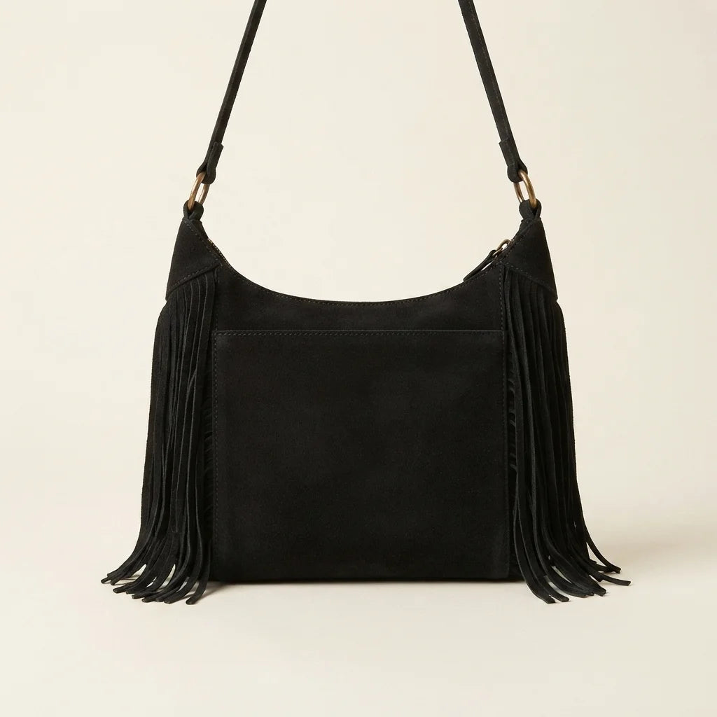Back panel of Black boho style fringe bag with strap attachments