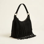 Black boho style fringe bag, three-quarter angle showing side depth