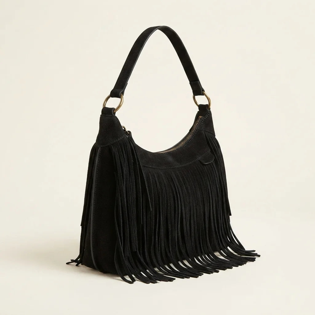 Black boho style fringe bag, three-quarter angle showing side depth