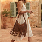 Woman wearing Dark Brown boho style fringe bag with swaying fringe