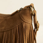 Close-up of fringe stitching and texture on Khaki boho style fringe bag