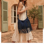 Woman wearing Navy boho style fringe bag with swaying fringe