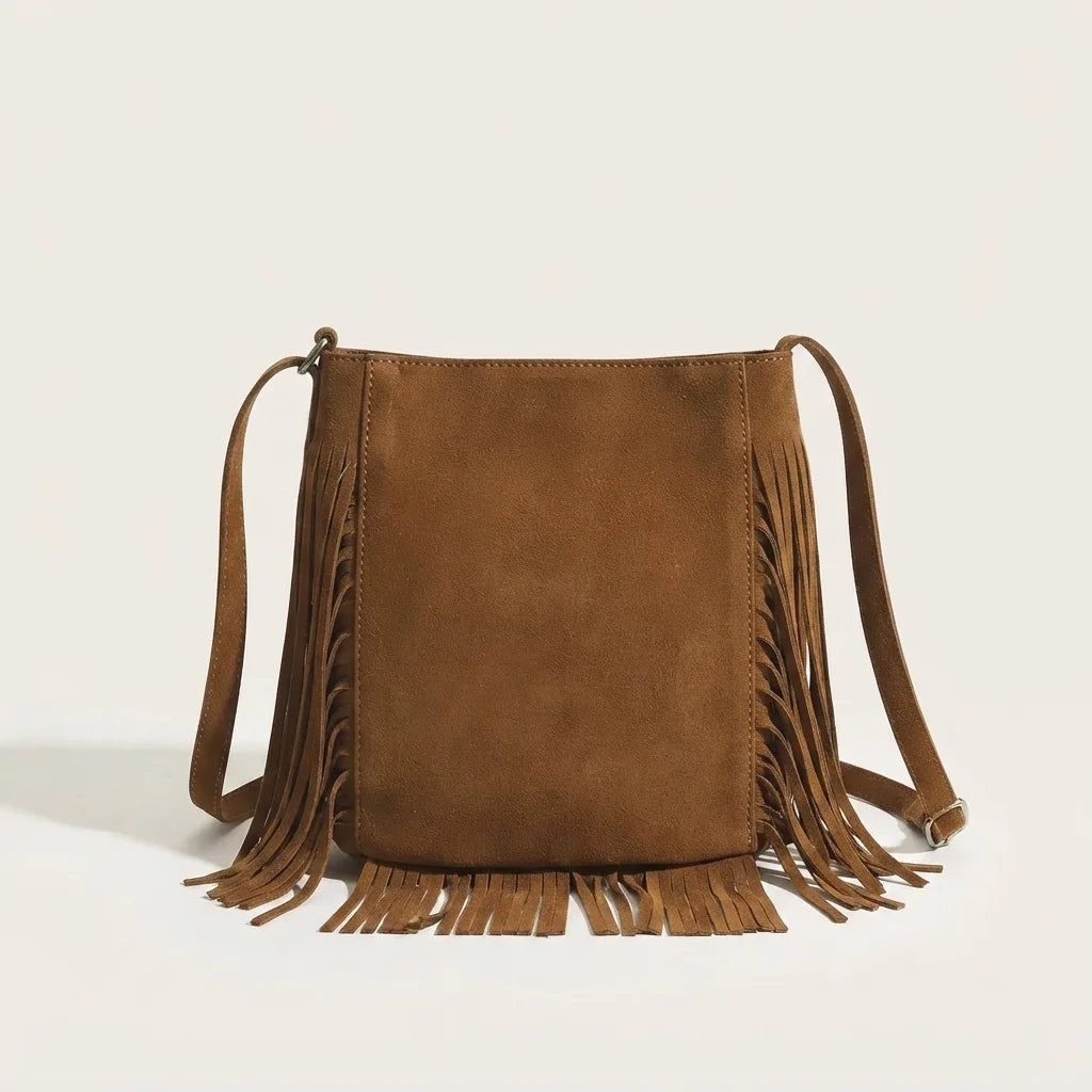 Back panel of Brown brown fringe bucket bag with strap attachments