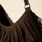 Close-up of fringe stitching and texture on Coffee brown fringe hobo bag