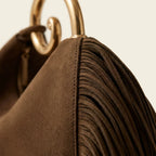 Close-up of fringe stitching and texture on Brown brown fringe shoulder bag