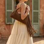 Woman wearing Brown brown fringe shoulder bag with swaying fringe