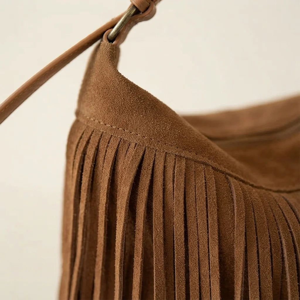 Close-up of fringe stitching and texture on Brown brown fringe suede bag