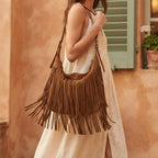 Woman wearing Brown brown fringe suede bag with swaying fringe