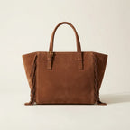 Back panel of Brown brown fringe tote bag with strap attachments