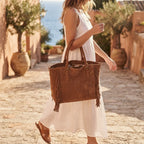 Woman wearing Brown brown fringe tote bag with swaying fringe