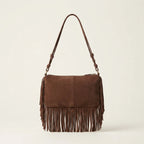 Back panel of Brown brown fringed sling bag with strap attachments