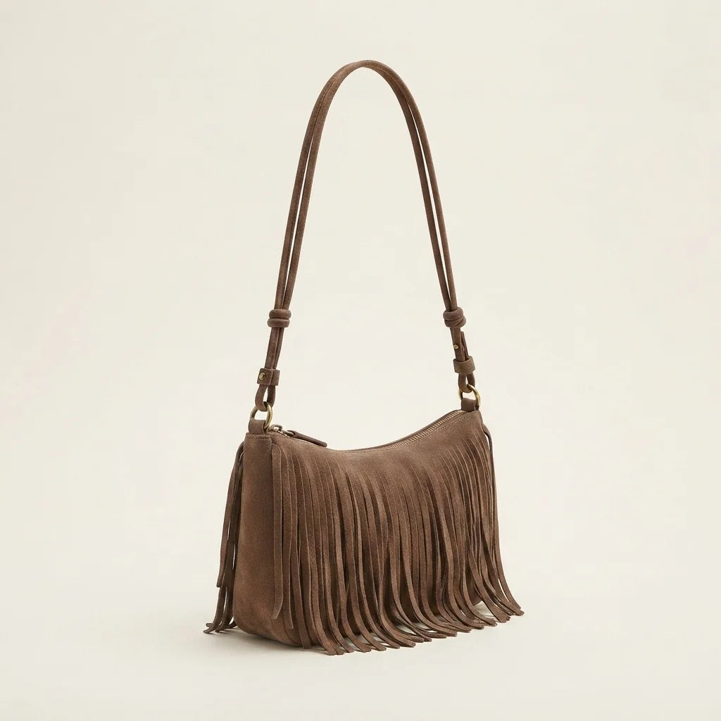 Brown brown fringed sling bag, three-quarter angle showing side depth