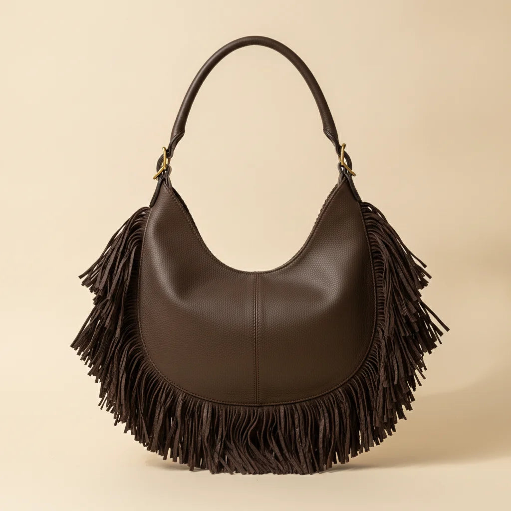 Back panel of Brown brown leather hobo fringe bag with strap attachments