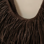 Close-up of fringe stitching and texture on Brown brown leather hobo fringe bag