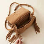 Interior lining and pockets of Light Brown brown satchel bag with fringe