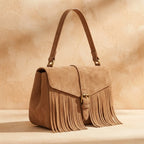 Light Brown brown satchel bag with fringe, three-quarter angle showing side depth