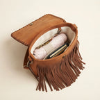 Interior lining and pockets of Brown brown studded fringe hobo crossbody bag