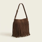 Brown brown suede fringe crossbody bag, three-quarter angle showing side depth