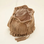 Interior lining and pockets of Khaki camel fringe bucket bag